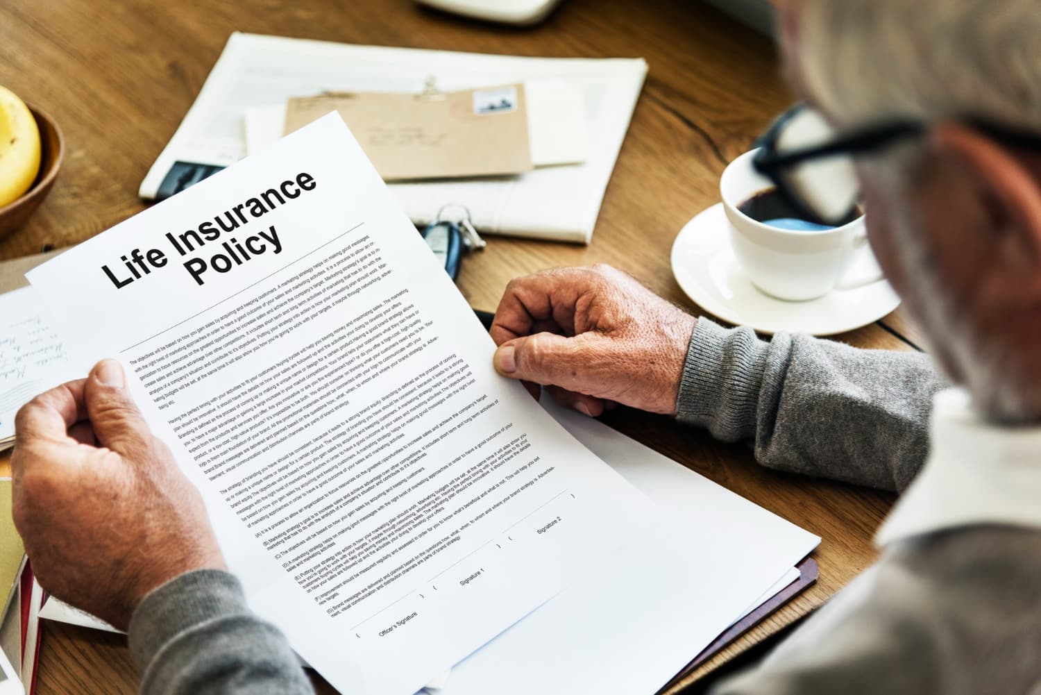 Person reviewing a life insurance policy document