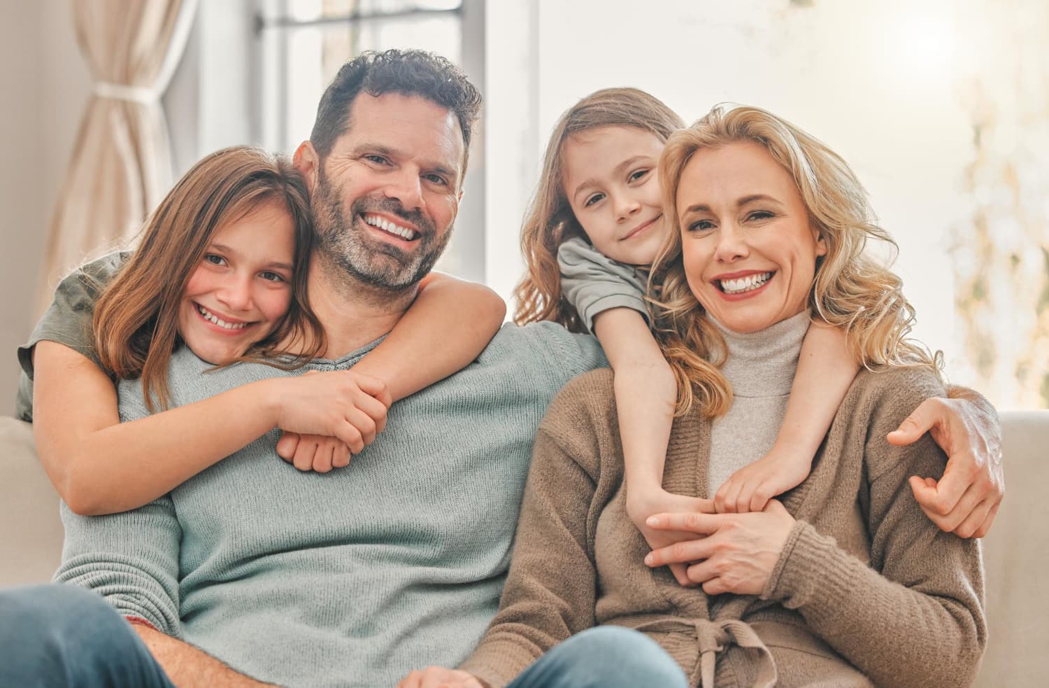 Happy family — parents and children smiling together