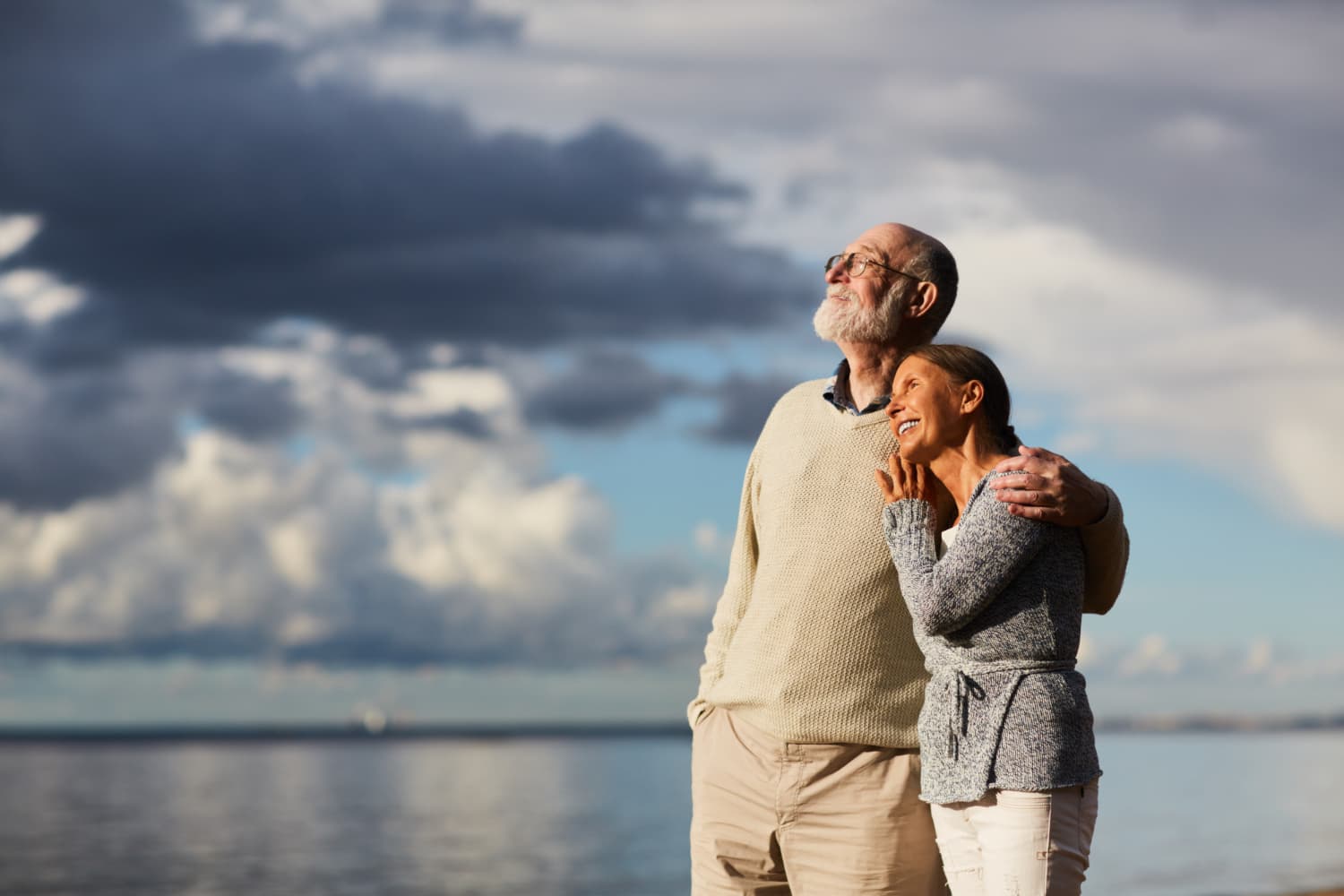 Retired couple looking up together